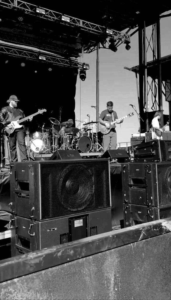 Nic Hitchens performing with a band.